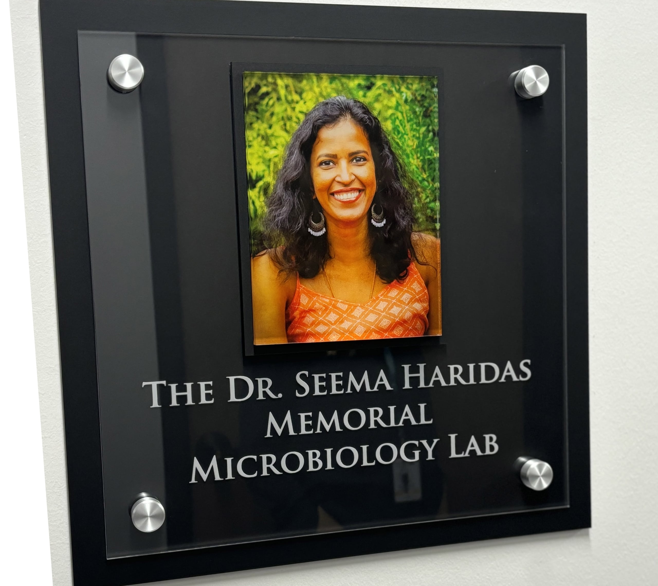 Plaque outside The Dr. Seema Haridas Memorial Microbiology Lab